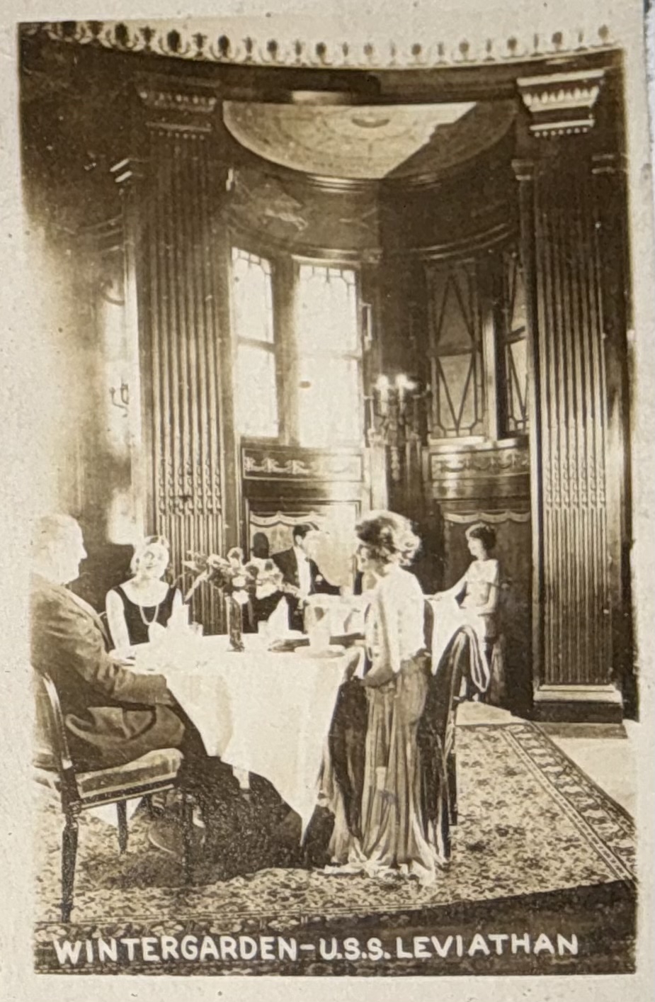 Passengers seated in the winter garden.