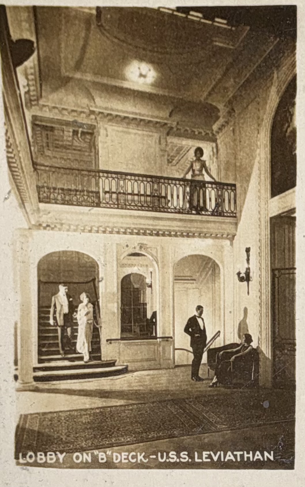 Two-level lobby on B deck with gallery and stairs.