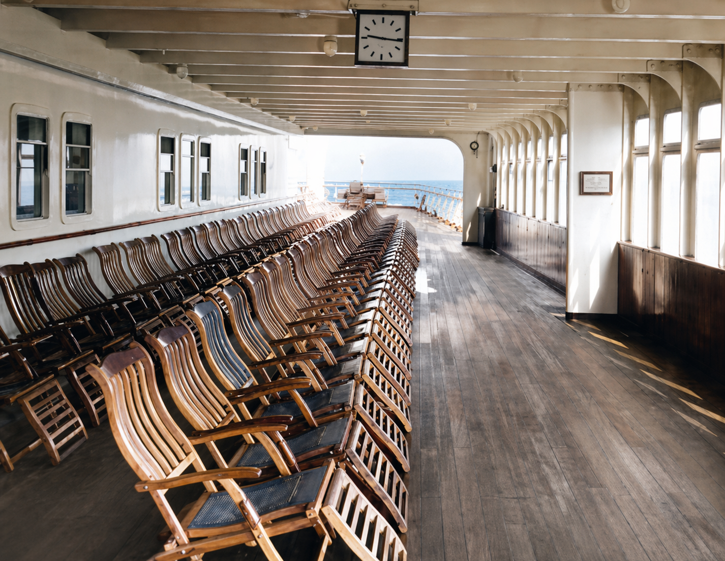 Passengers on deck aboard RMS Queen Mary during a crossing.