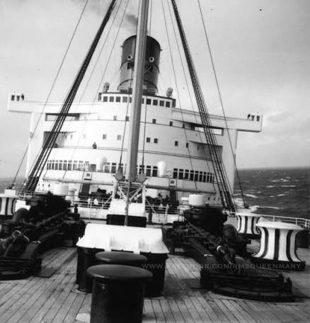 RMS Queen Mary at sea in rough weather.