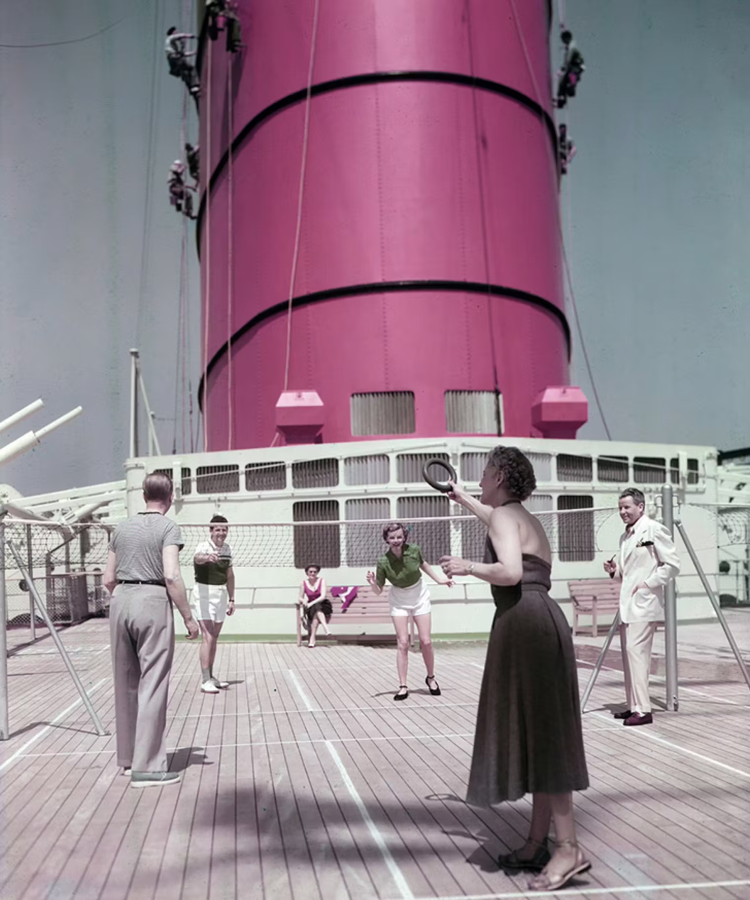 Passengers socializing aboard RMS Queen Mary.
